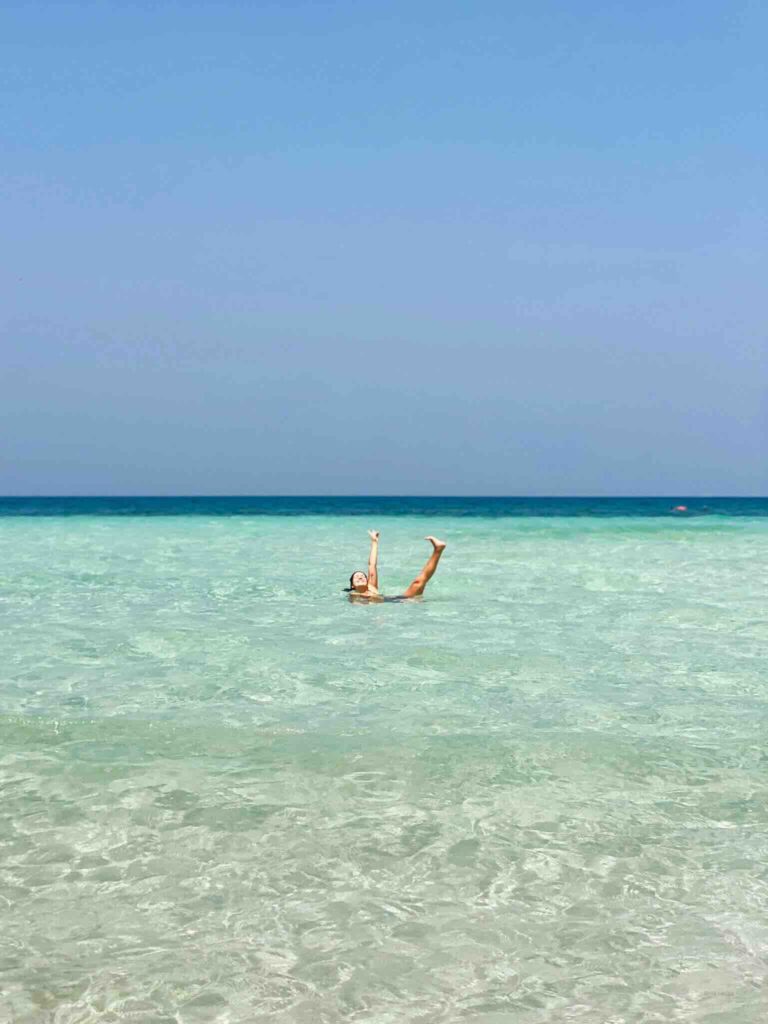 Eva swimming in turquoise water at Havelock, Andaman and Nicobar Islands, India.