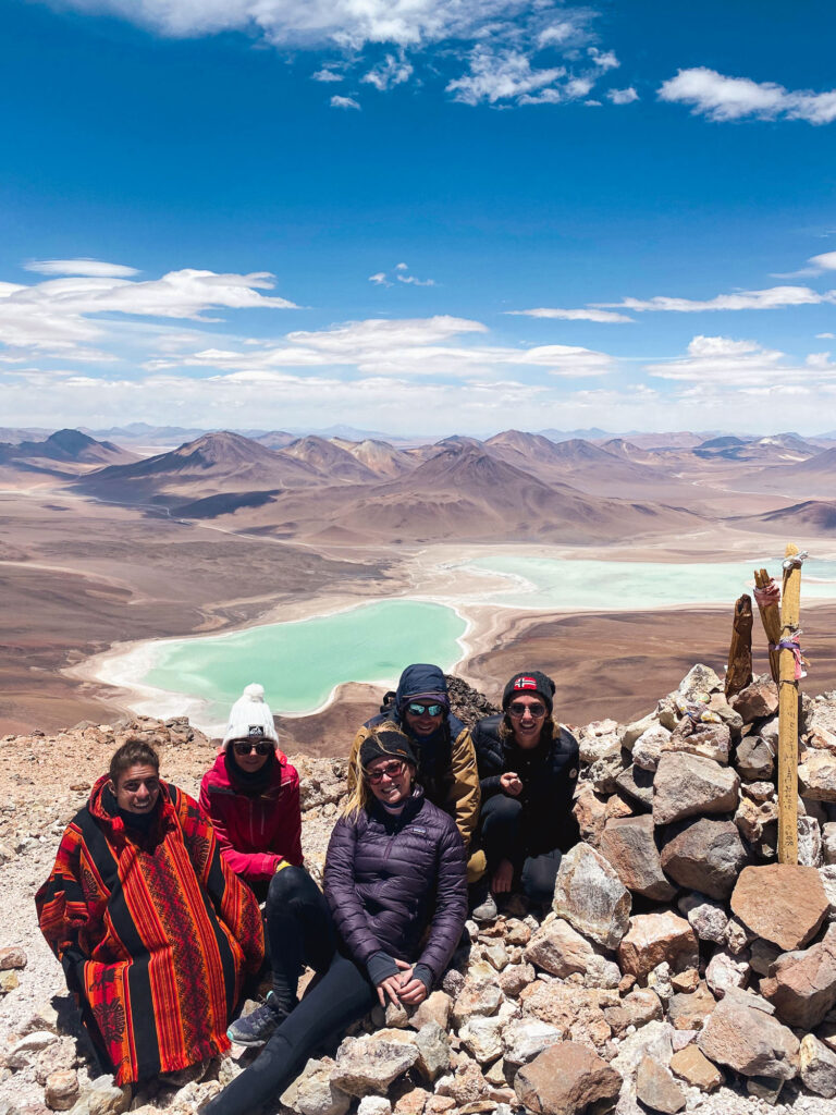 Group moment at the summit of Licancabur Volcano, with spectacular views over Laguna Verde and the Bolivian Altiplano, Sud Lipez.