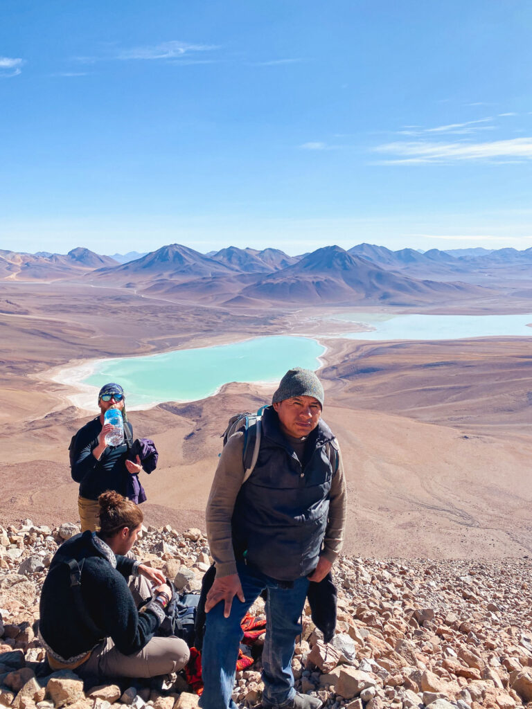 Part of the group ascending Licancabur Volcano, with Laguna Verde and the mountains in the background, Sud Lipez, Bolivia.