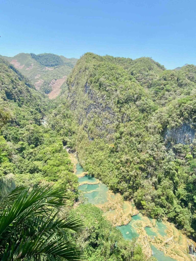Aerial view of the waterfalls and natural pools of Semuc Champey surrounded by tropical forest in Guatemala