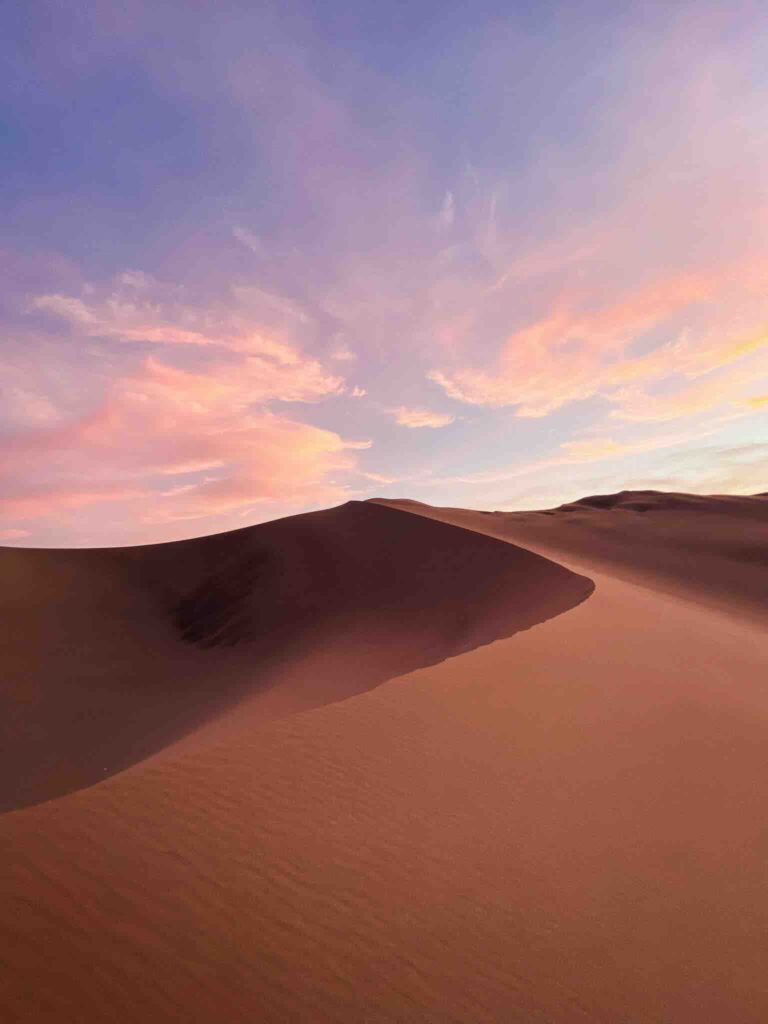 Sunset over the dunes of Huacachina, Peru.