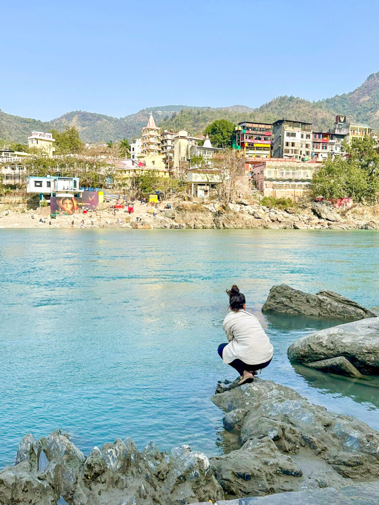 Eva by the Ganges in Rishikesh, India, during her yoga training
