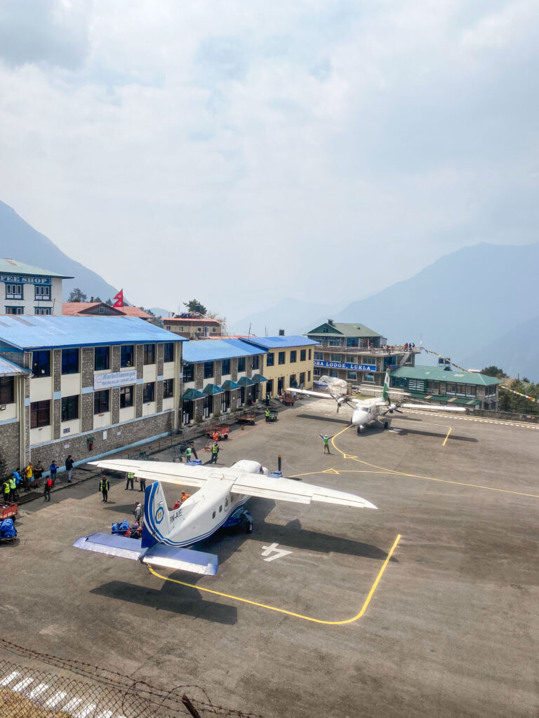 Landing of a plane at Lukla Airport, gateway to the Three Passes Trek and Everest Base Camp, Nepal.