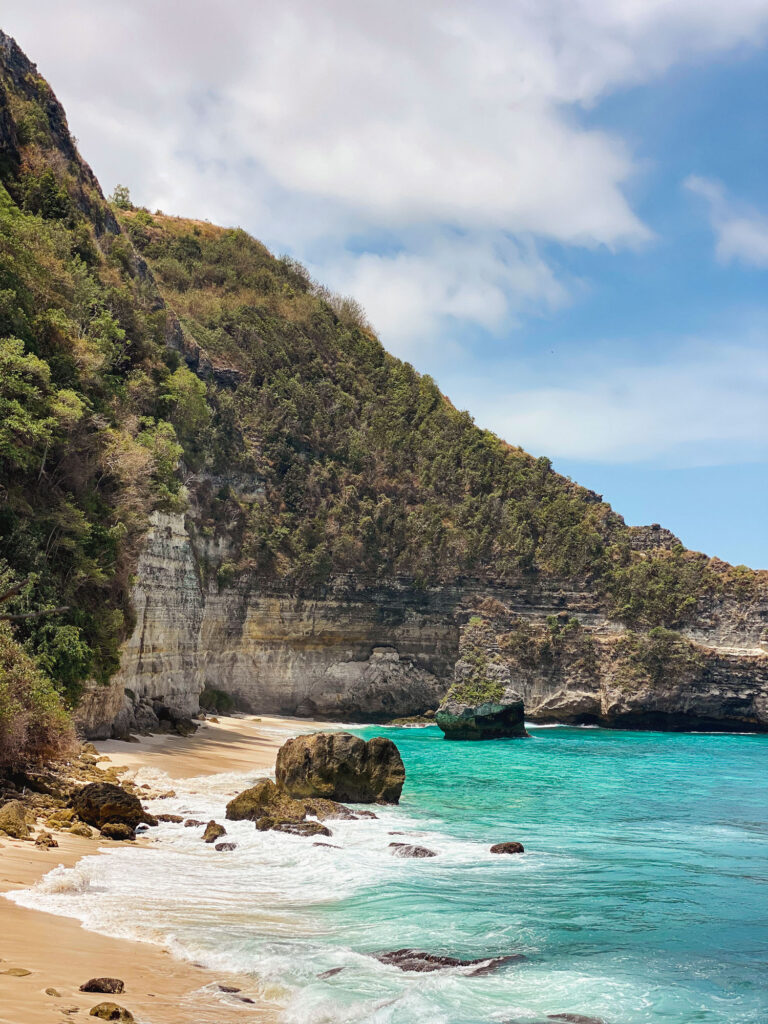 Wild landscape of Suwehan Beach in Nusa Penida, one of the island’s most preserved beaches.