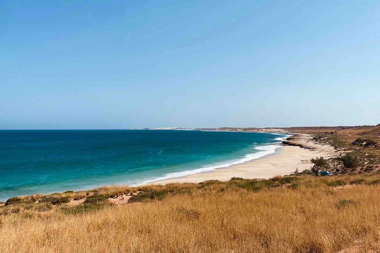 Panoramic view of Red Bluff Beach, a wild and scenic spot in Western Australia.