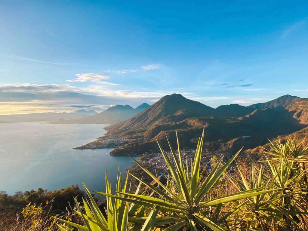 View from the hills of San Pedro over Lake Atitlán in Guatemala with volcanoes in the background