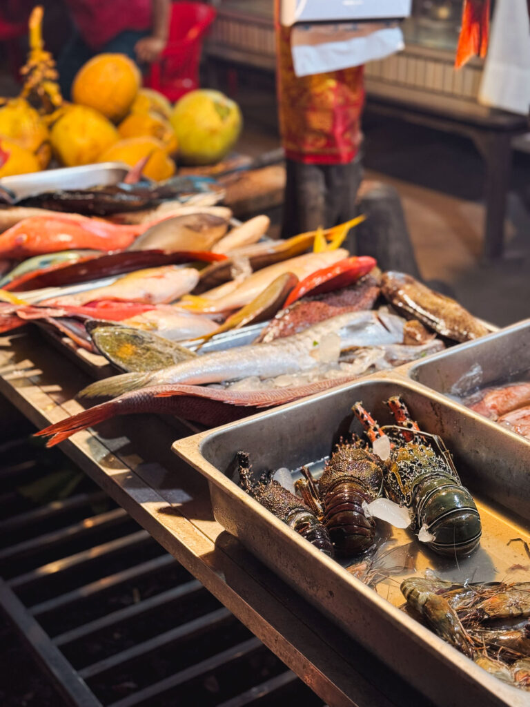 Fresh fish ready to be grilled at a warung barbecue.