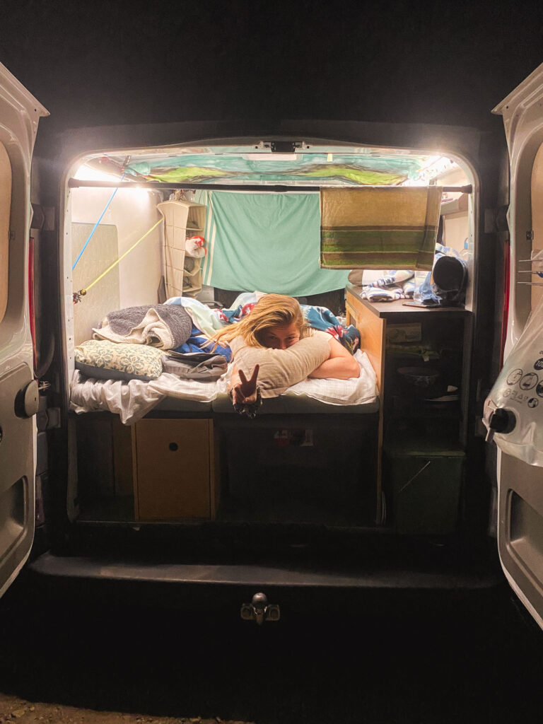 Manon in the van at night during our Spain-Portugal road trip.