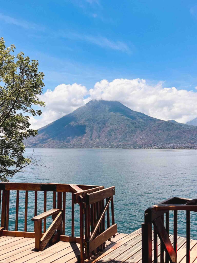View from San Pedro overlooking Lake Atitlán with a volcano in the background in Guatemala